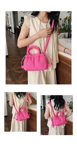 Detailed close-up of bright pink quilted bubble bag featuring drawstring ruched texture