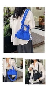 Close-up of soft quilted cloud bag with puffy knotted straps and nylon texture
