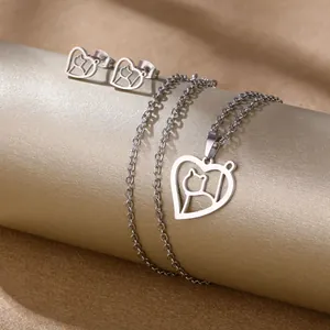 Polished stainless steel jewelry set featuring hollow heart and cat pendant and stud earrings