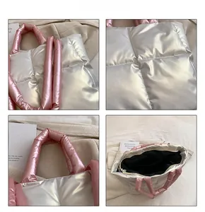 Detail view of quilted silver tote bag with soft pink handles and zip closure