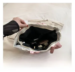 Detail view of large tote bag interior showing spacious compartments and black lining