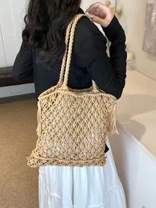 Bohemian woven mesh tote bag in khaki with fringe details for summer beach vacations