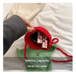 Internal capacity of the strawberry crochet bag showing makeup storage details
