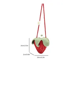 Cute strawberry-shaped crochet knit bag with green leaf detail and a red shoulder strap