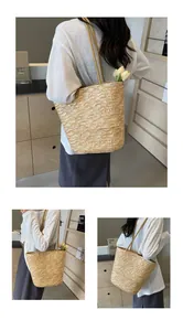 Macro details of French straw woven tote bag showing fine texture and long shoulder straps