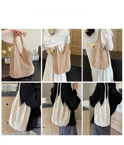 Detail of hand-woven beige knit tote bag showing hollow-out texture and large capacity