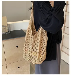 Close-up of beige woven mesh shoulder bag showing the intricate handmade texture