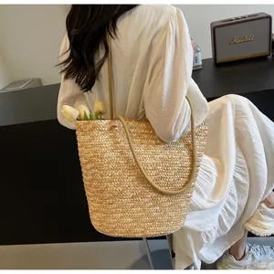 Macro detail of natural straw weave and tulip inside this spacious French tote bag