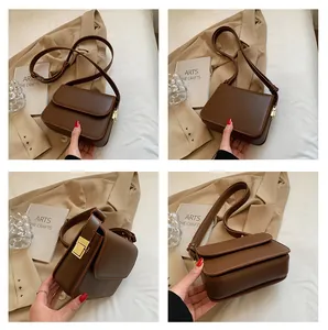 Vistas detalladas de un bolso bandolera de cuero marrón vintage con hebilla dorada