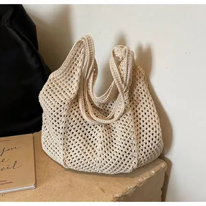 Close-up of the beige crochet mesh texture on the large capacity knit tote bag