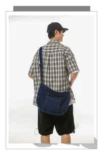 Close-up of durable dark blue denim tote bag with reinforced stitching for daily use
