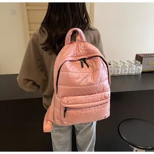 Rear view of pink quilted bubble backpack featuring a soft padded texture and adjustable straps