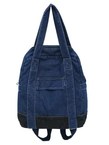 Denim backpack with top handles and adjustable shoulder straps on a clean white background
