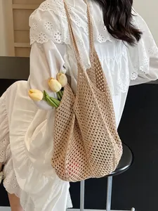 Large capacity beige woven hollow tote bag for women with minimalist aesthetic style