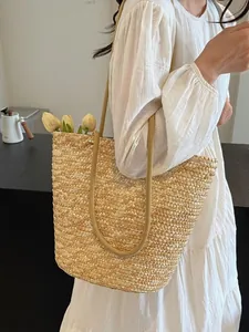 French style straw woven tote bag with rope handles for beach vacation and summer outings