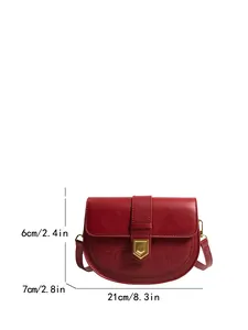 Retro red saddle bag with crocodile texture and dimensions of 21cm by 7cm