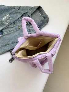 Large light purple padded puffer tote bag with quilted finish and interior zipper pocket