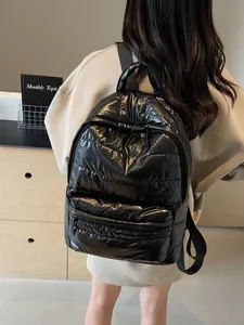 Black quilted down-style backpack for women with large capacity and glossy finish