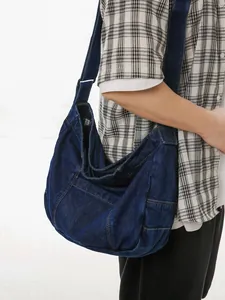 Minimalist large capacity denim tote bag with wide strap and contrast stitching details