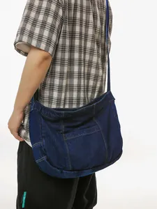 Large dark blue washed denim tote bag with contrast stitching for casual daily commute