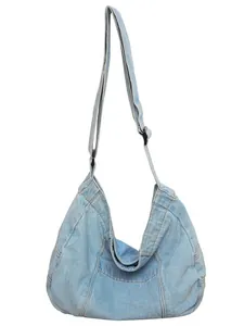 Large capacity light blue denim tote bag with adjustable strap and casual slouchy design