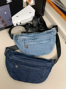 Washed denim crossbody chest bags in light and dark blue with adjustable straps