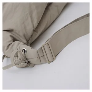 Close-up of durable nylon fabric detail with plastic buckle and metallic eyelets