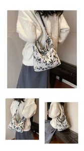 Detail of Chinese style ivory canvas shoulder bag with black leaf flocking pattern