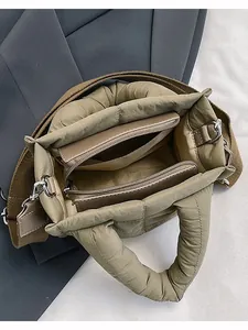 Quilted padded crossbody bag in khaki with a spacious interior and adjustable strap