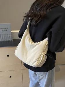 Lightweight padded space cotton crossbody bag with side drawstrings in beige color