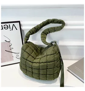 Detail of army green quilted cloud bag with padded handle and adjustable shoulder strap