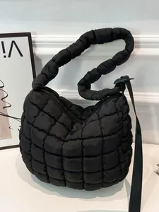 Chic black quilted cloud bag with padded handle and adjustable strap for women