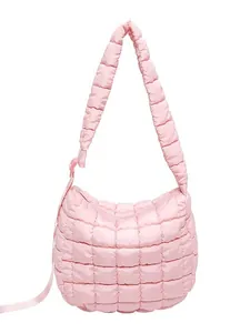 Pink quilted puffer shoulder bag with soft cloud texture and wide padded strap