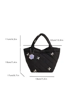 Quilted black handbag with white bow embroidery and dimensions 11cm by 19cm by 18cm