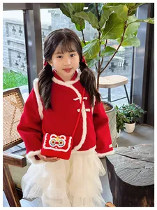 Detail of red Chinese style vest with white faux fur trim and lion dance crochet bag