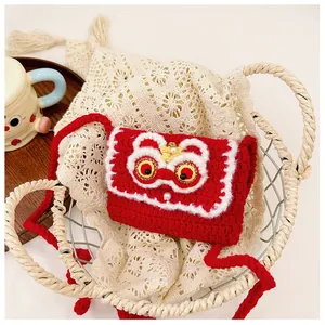 Detail of red handmade crochet lion dance mini bag with woven texture and pearl button