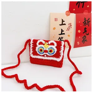 Detail of handmade crocheted red lion dance bag with woven strap for Lunar New Year