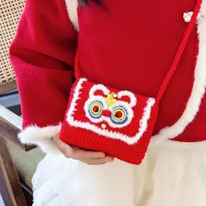 Mini red crochet lion dance crossbody bag for kids featuring festive pearl accents