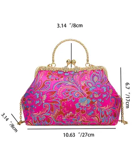 Detail of pink embroidered silk handbag with metal handle and dimensions 27x17x8cm