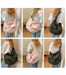 Quilted oversized shoulder bag with large double front pockets in olive and pink