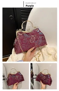 Detail of vintage purple floral jacquard shell bag with ornate golden handle and chain