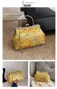 Detail of gold Chinese embroidery evening bag with floral patterns and metal clasp