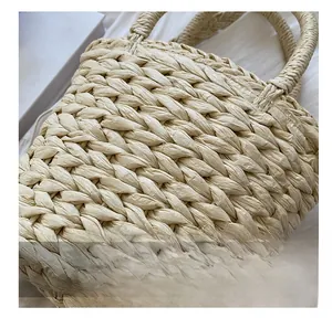 Detailed close-up of natural straw weave texture on a handmade summer bucket bag