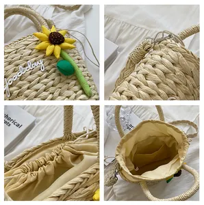 Detail view of straw tote with sunflower decor, drawstring liner and interior pocket