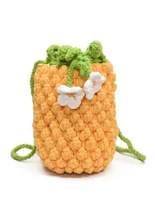 Cute yellow hand-woven pineapple bucket bag with white flowers and green strap for kids
