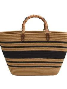 French straw woven tote bag with bamboo handles and chic black stripes for beach summer