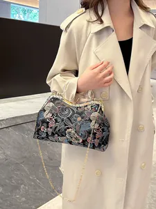 Vintage Chinese shell bag with colorful floral embroidery and elegant gold chain strap