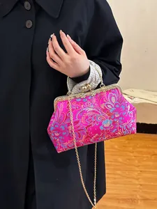 Elegant fuchsia brocade embroidery handbag with floral patterns and gold chain strap