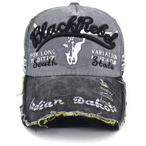 Close-up of distressed washed cotton baseball cap with vintage frayed edges and embroidery