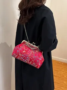 Red vintage floral brocade clasp bag with metal chain strap and jacquard texture